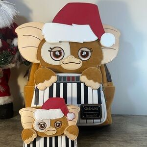 Loungefly gremlins Christmas backpack and Wallett. Santa hat is removeable